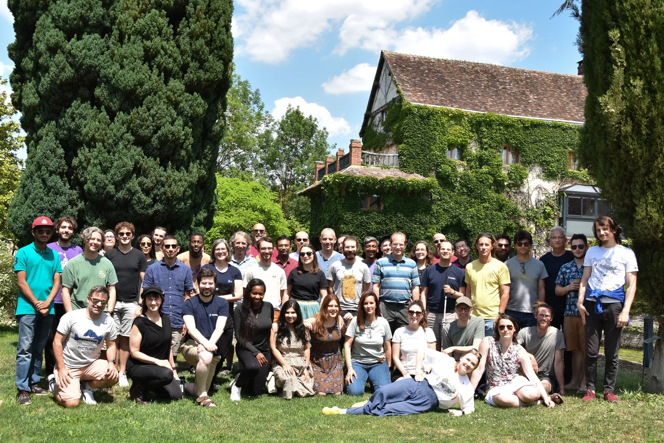 The Tarides team outdoors in the countryside during their offsite, standing together in a scenic rural setting.